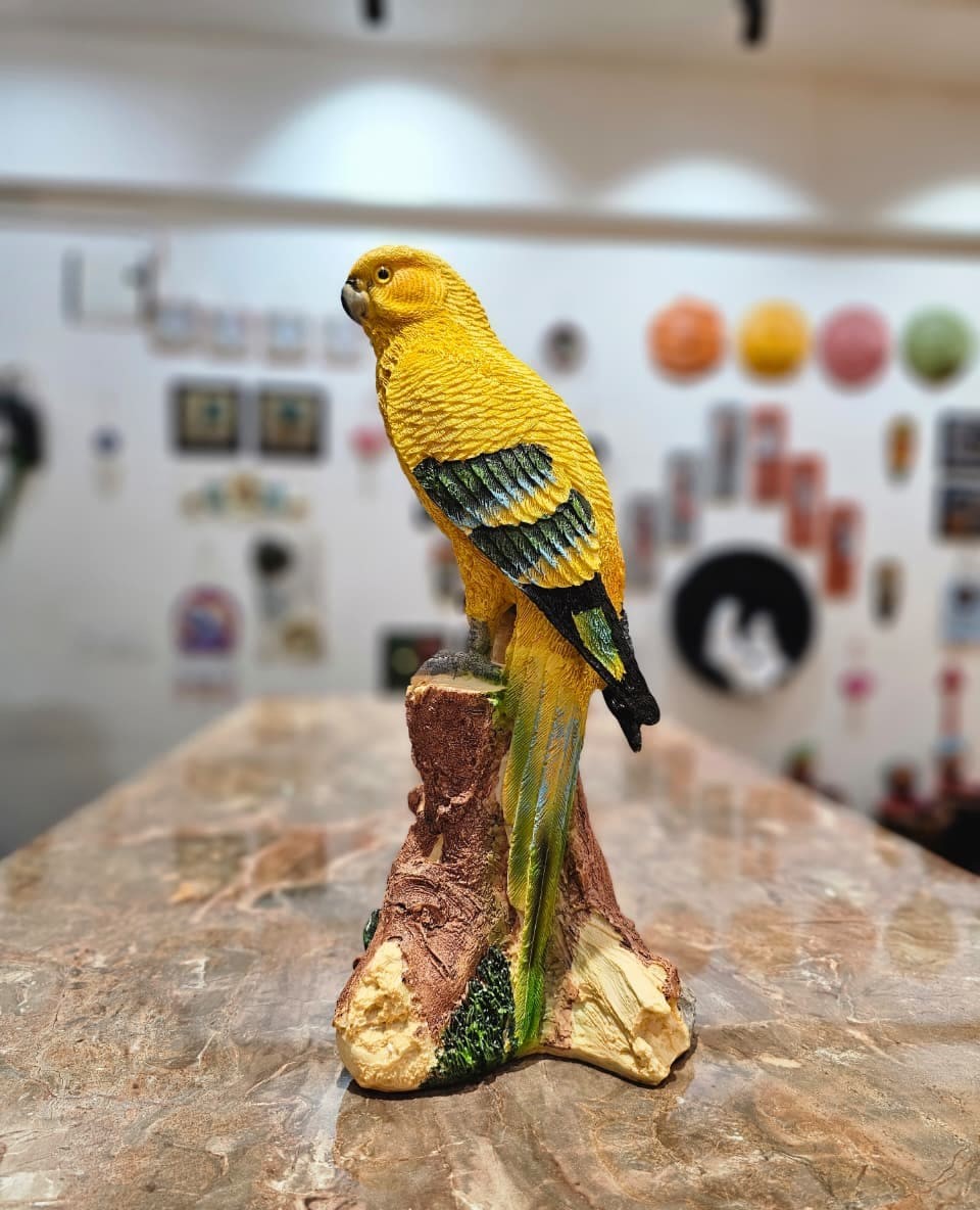 Yellow Bird on a wood